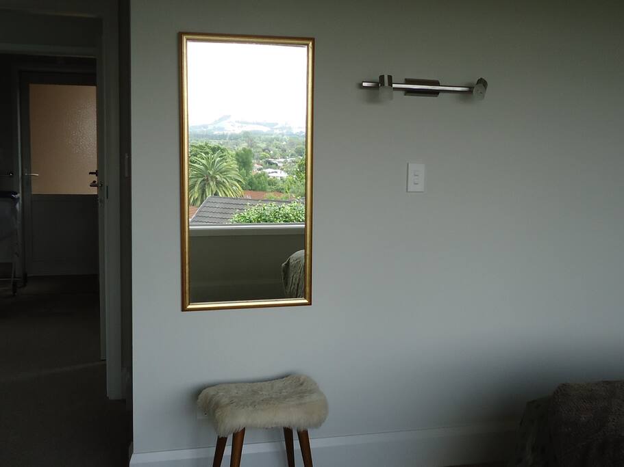 Convenient lighting from beds, easy access to outdoors and conveniences.