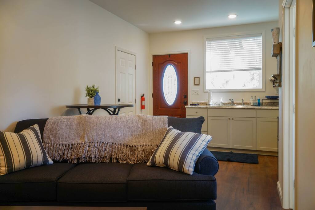 Door on the left provides garage access, and full-size washer and dryer.