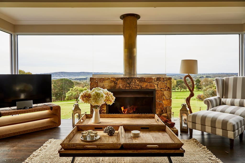 The huge stone fireplace and luxury furnishings in the cottage with views to die for.