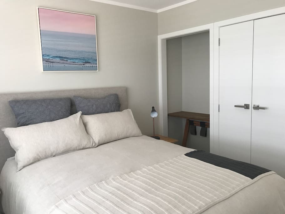 Main bedroom with Queen size bed and television