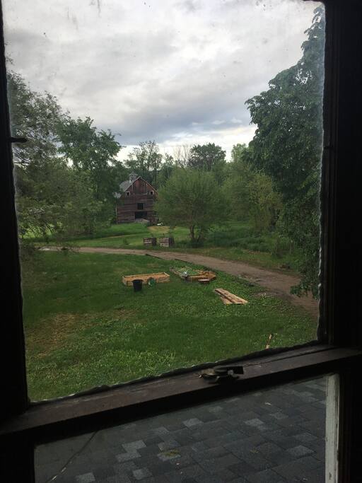 View from hallway outside of guest room showing barn and garden area!
