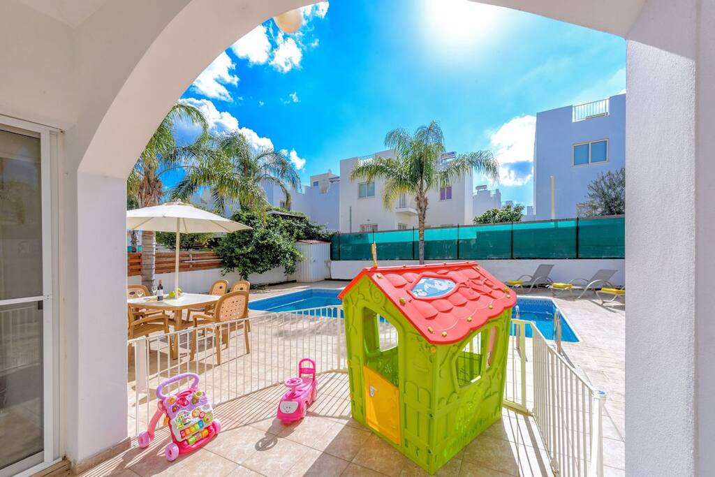 Villa Anastasia fenced play area with play house