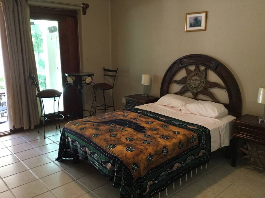 Bedroom 1 with sitting area and garden view