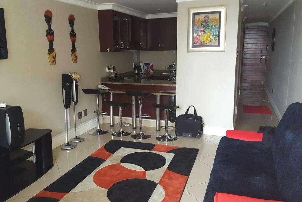 Open plan kitchen and lounge with balcony