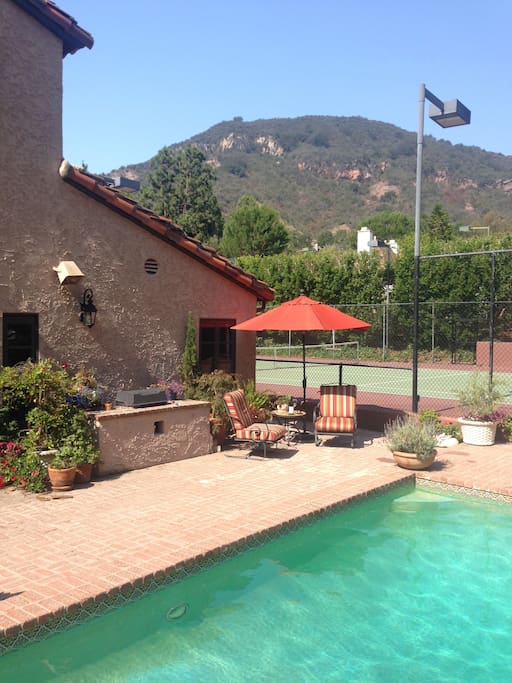 Summertime in our garden. Tennis anyone or perhaps a morning hike followed by a dip in the pool?