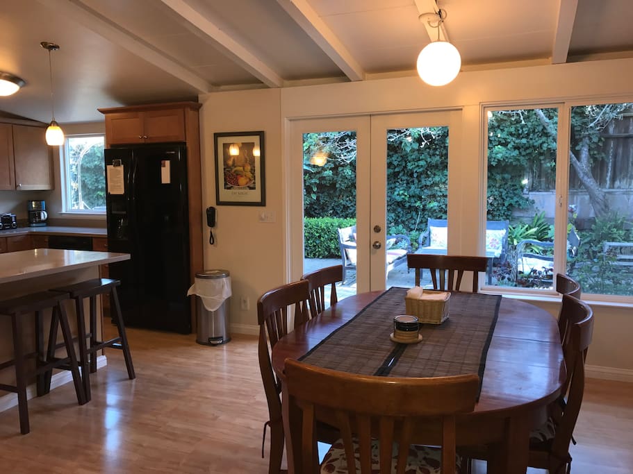 Open dinning room with seating for 6 with two extra bar stools