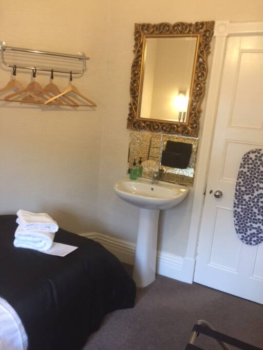 Single Room with basin, hospitality tray, linen and towels