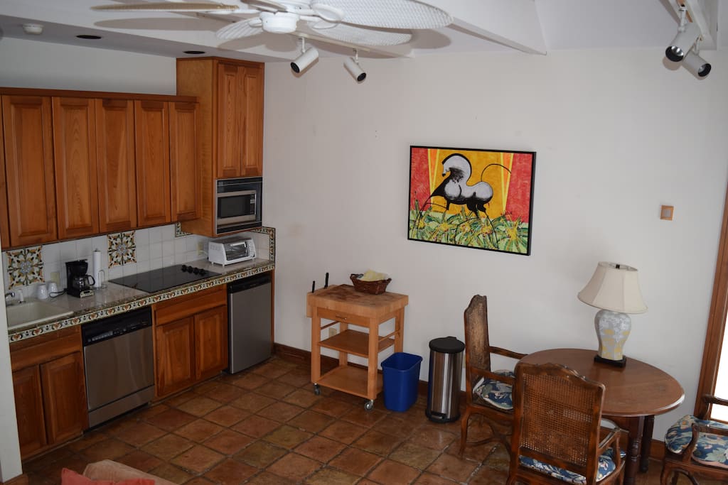Kitchen includes a fridge, cook top, coffee maker, toaster-oven, and wine cooler