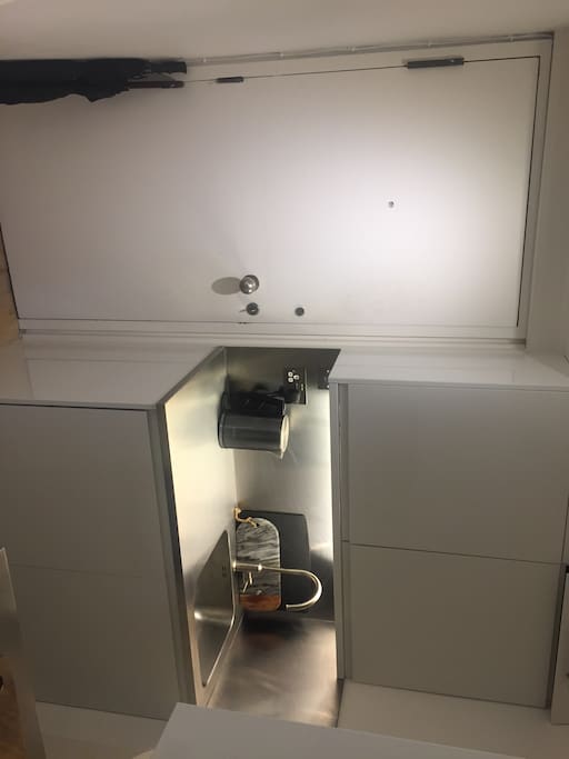 Kitchen area - sink and cupboards