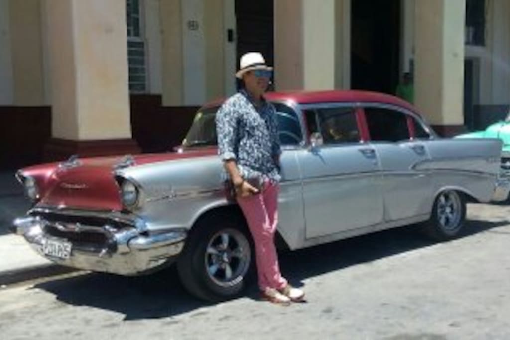 The Host and the classic car with air conditioning for your pick up at the airport,