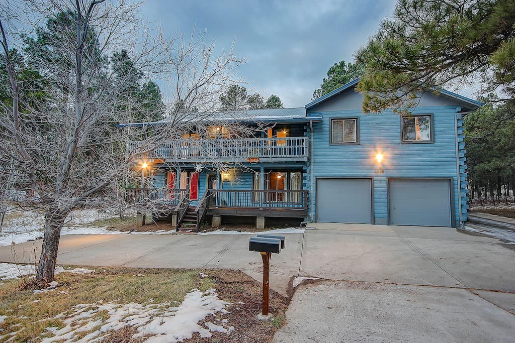 You have your own private entrance to the right of the garage, and private parking area as well! The apartment is located over the garage!