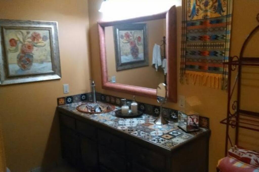 Bath is adorned with colorful tiles from Mexico