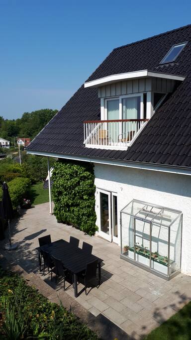 Private terrace, small green house and balcony on the south side of the house