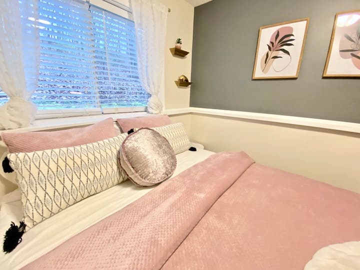 Your private, cozy bedroom comes equipped with a queen bed with 4" memory foam topper, smart TV with Prime, Netflix, and more, full closet, and desk/workspace.