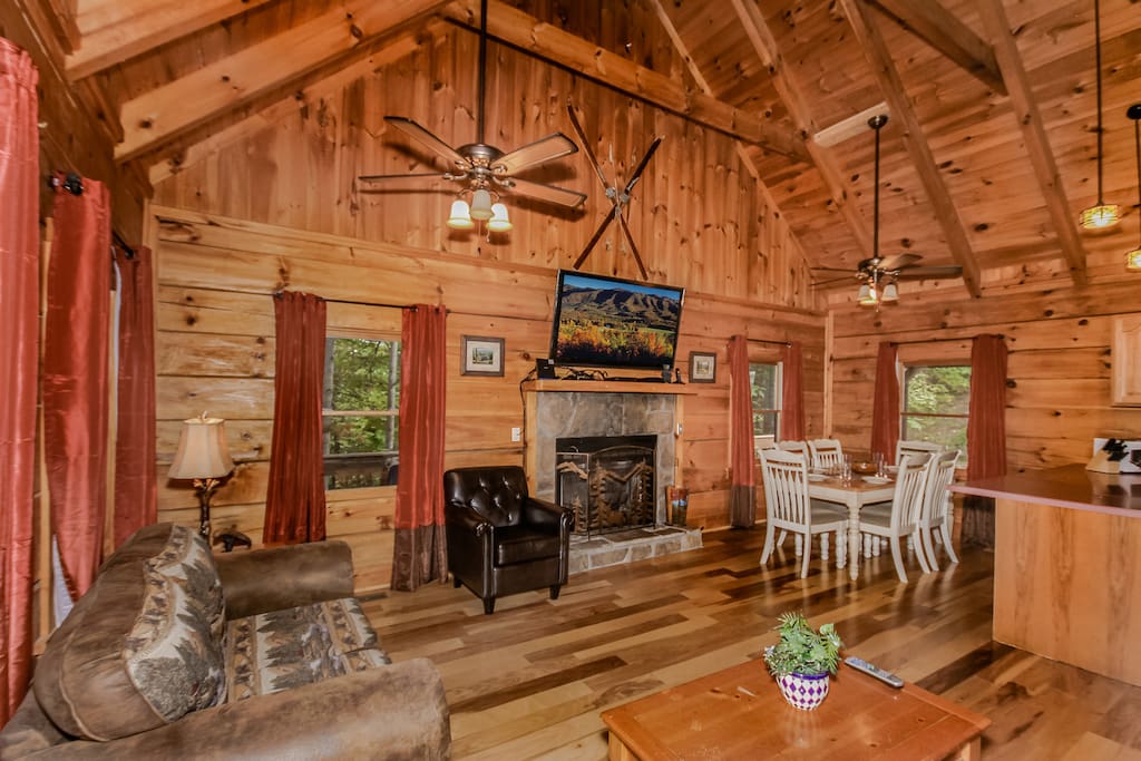 Great room with a sofa sleeper and love seat. Gather by the gas fireplace which is operable during the colder months