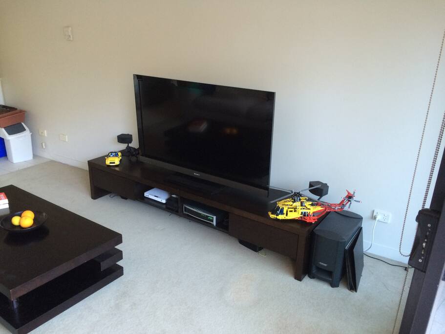 Living Room with a 55" TV, AppleTV, BOSE Sound system and loads of DVDs