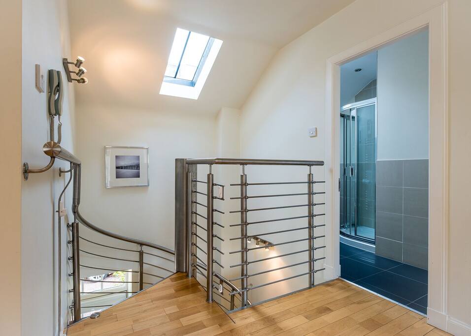 Top of spiral staircase (with stairgate if required)