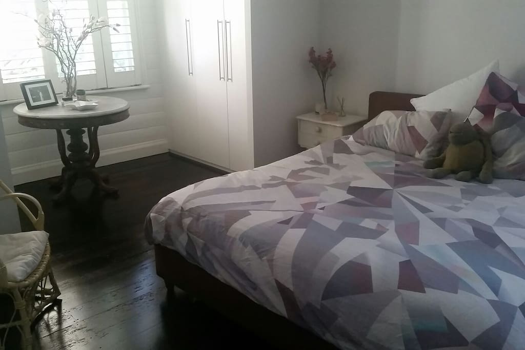 Main large bedroom with king size bed and wardrobes
