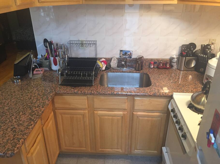View of kitchen with queen size Casper bed in the background (nice, open layout!)