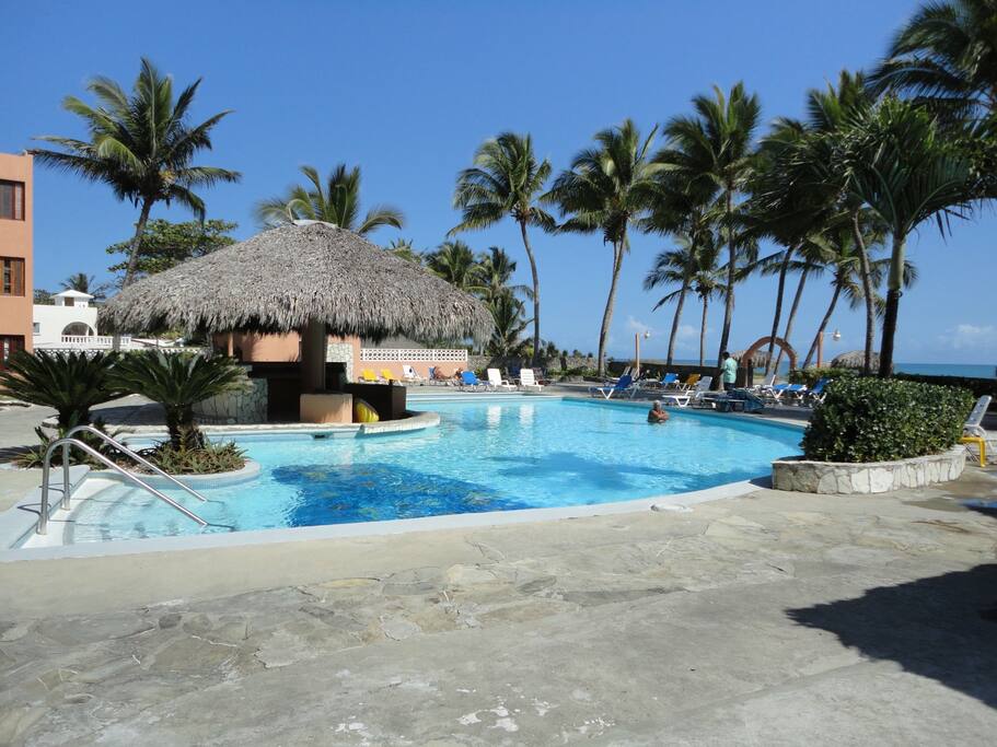 Relax by the pool while listening to gentle waves