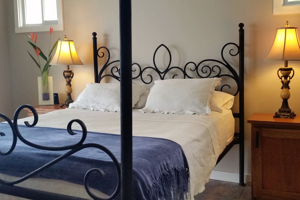 The ocean bedroom - with hand forged wrought iron 4 poster bed and pillow top mattress