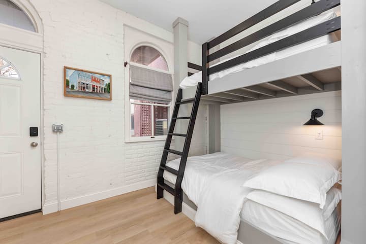 Twin over full custom bunk beds in semi-private open sleeping area