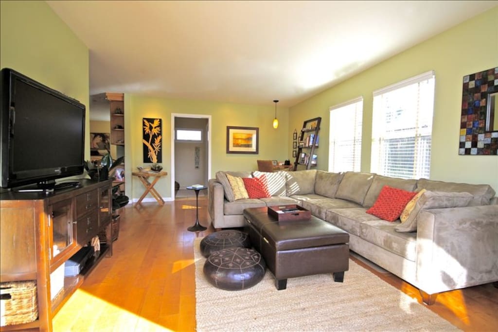 Oversized great room has large flat-screen TV, over 100 DVDs, and CD collection.