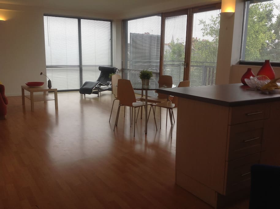 Spacious lounge with huge windows leads onto balcony