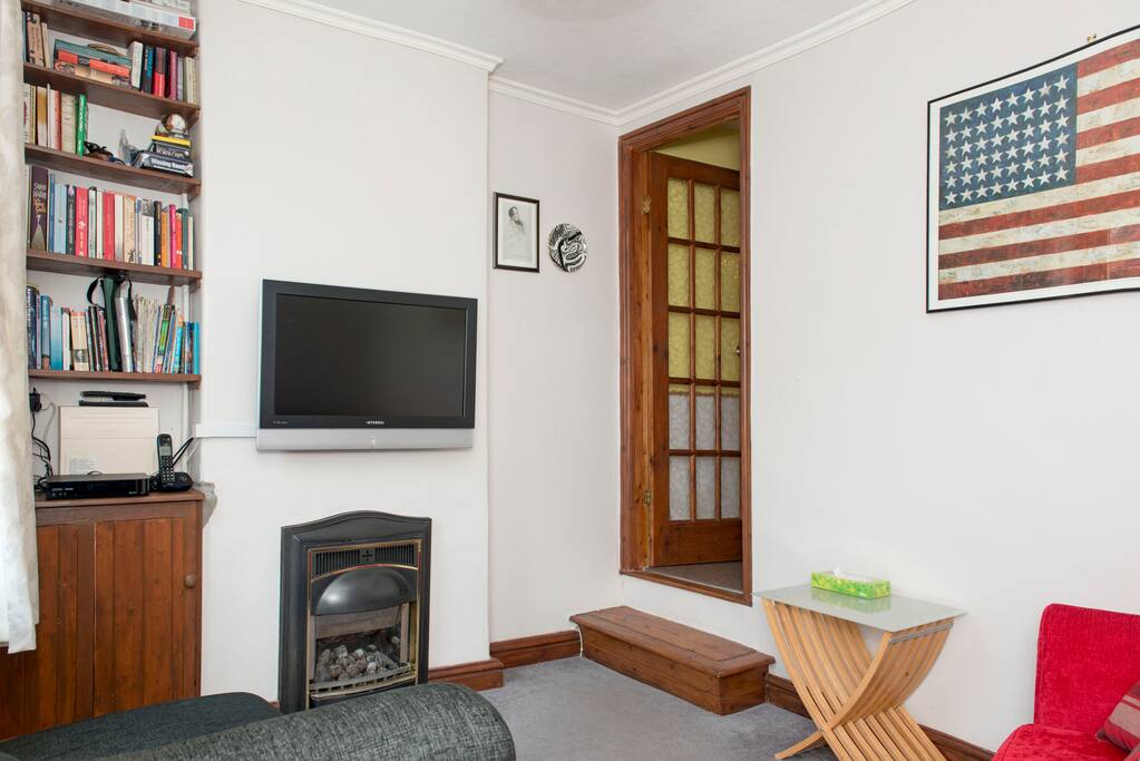 Living room (again). There is a gas fireplace too. The front door leads directly onto the street. There is wi-fi.