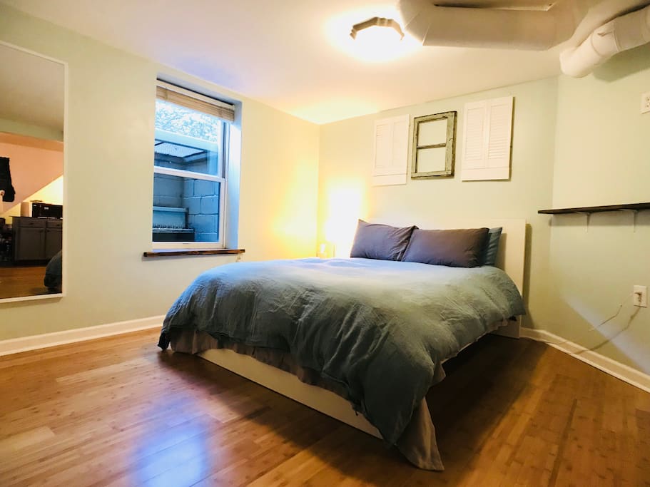 Bedroom - queen bed, closet, large window.