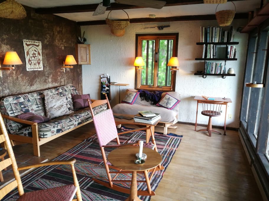 Cozy up on the sofas or breathe in the view form the rocking chairs