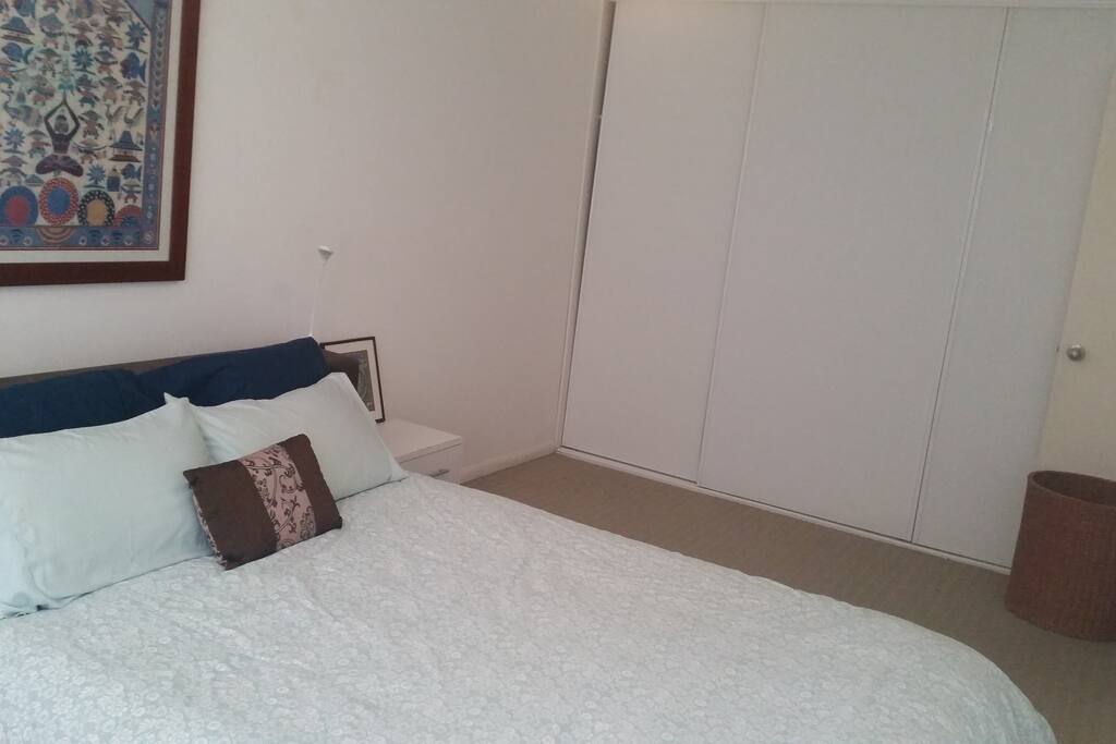 Hide your suitcases away in the wall length built-ins and relax in your home away from home!