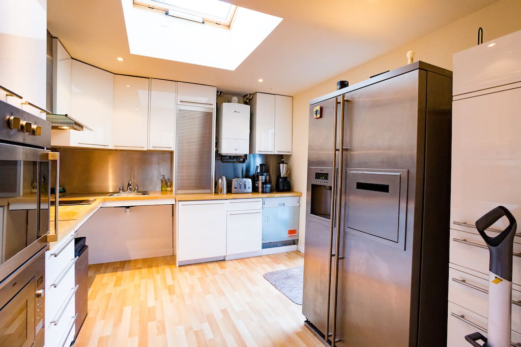 Double fridge freezer with water and ice dispensers.