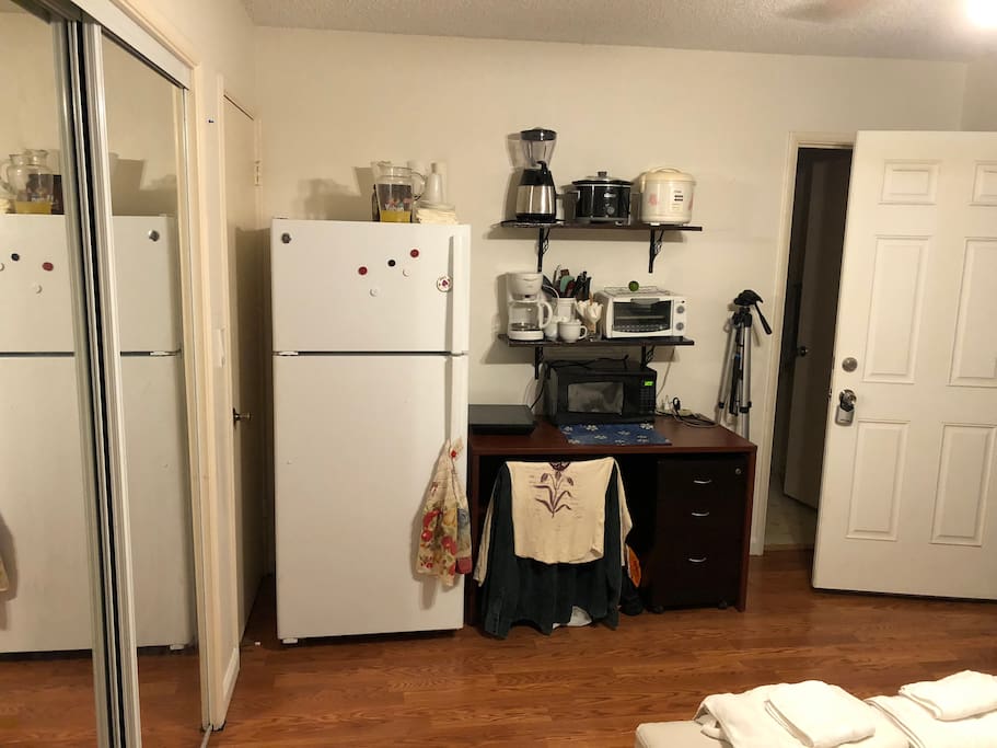 Small kitchenette includes microwave, hot plate, toaster oven, rice cooker, blender, crock pot, coffee maker, refridgerator/freezer, tea kettle, pots pans, dinnerware, etc...