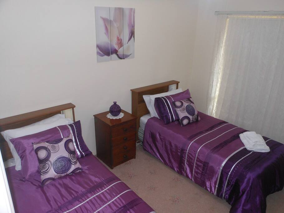 2 single beds in bedroom 2. Wardrobe, electric blankets, close to bathroom.