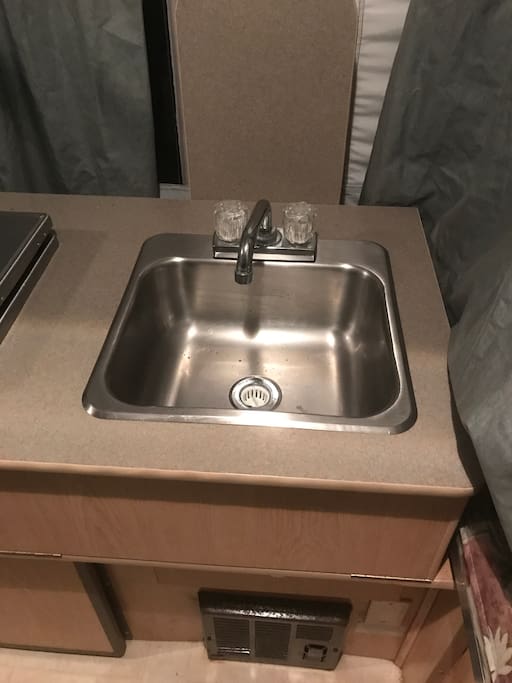 Clean faucet with running clean water and camping site