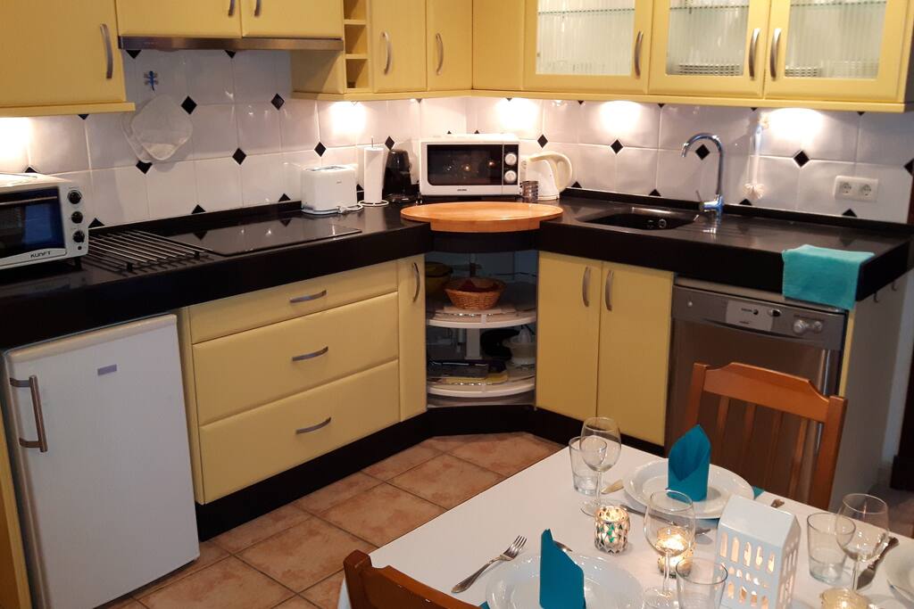 Well equipped kitchen and dining area.