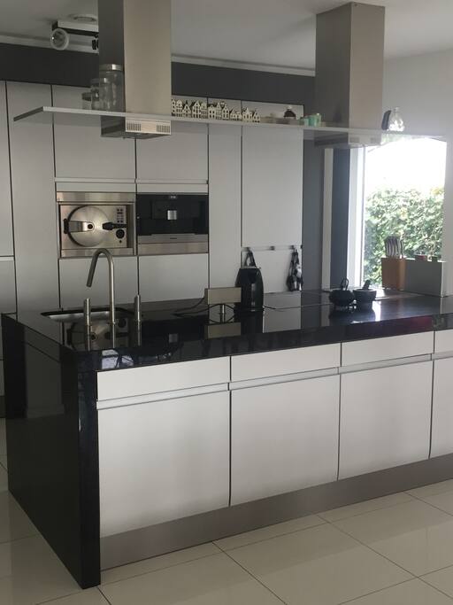 Modern kitchen complete with build-in nespresso, steam oven and Teppanyaki plate