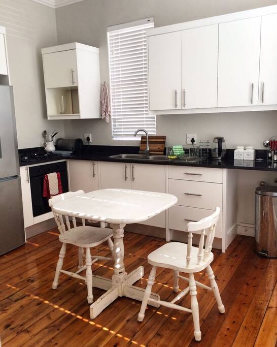 Kitchen, complete with refrigerator/freezer, gas stove, pantry space, & basic kitchen and cooking needs