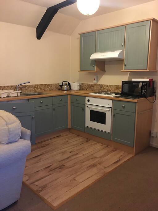 Kitchen area with everything you need to make a tasty meal. Fridge, microwave, oven and hob. All the tools, proper knives, crockery and importantly glasses !