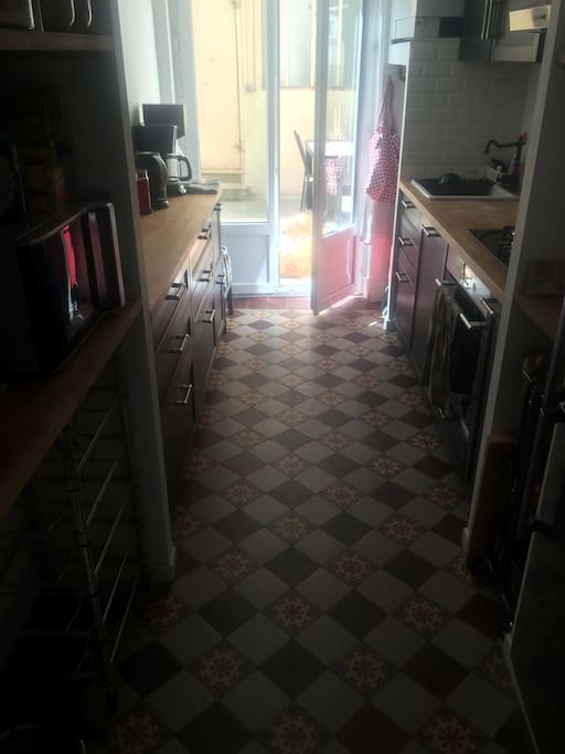 Kitchen (with all modern appliances), with view toward the little courtyard.