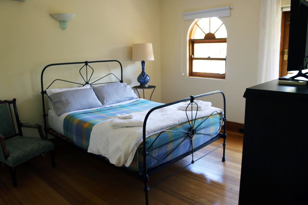 upstairs bedroom with balcony