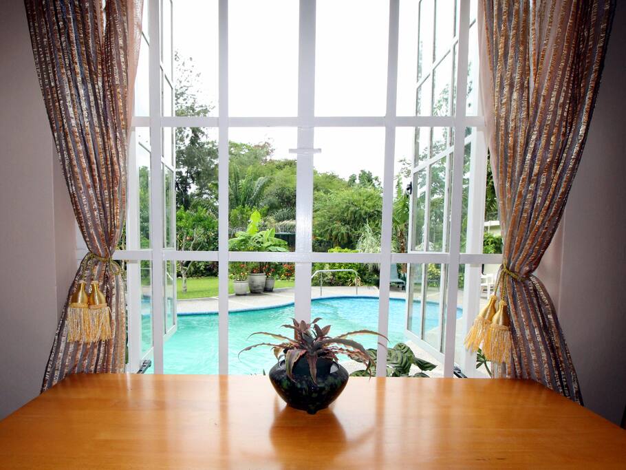 Dining space overlooking pool