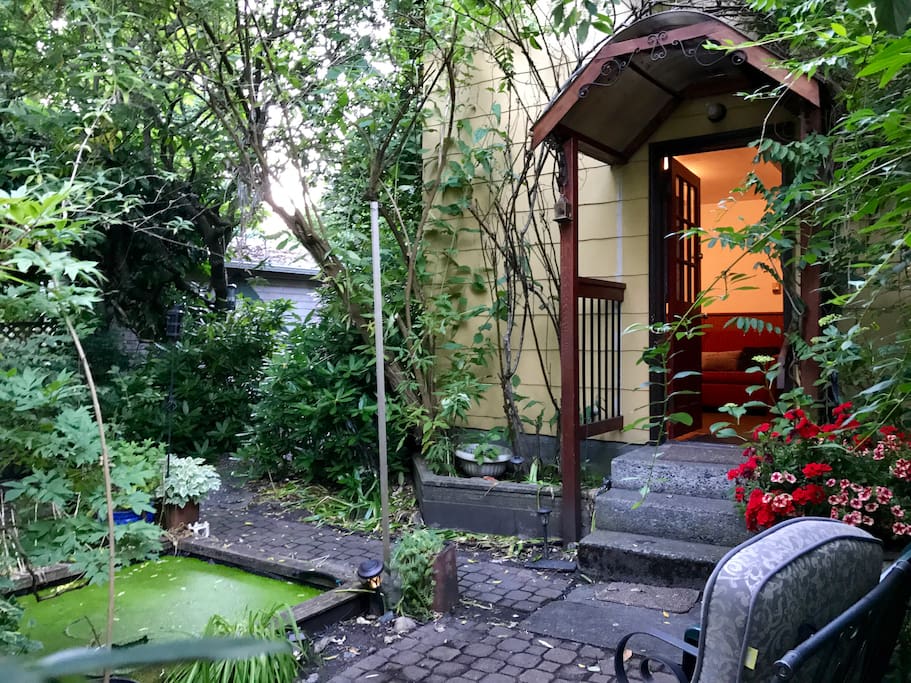 The cottage has a pond and sitting area.