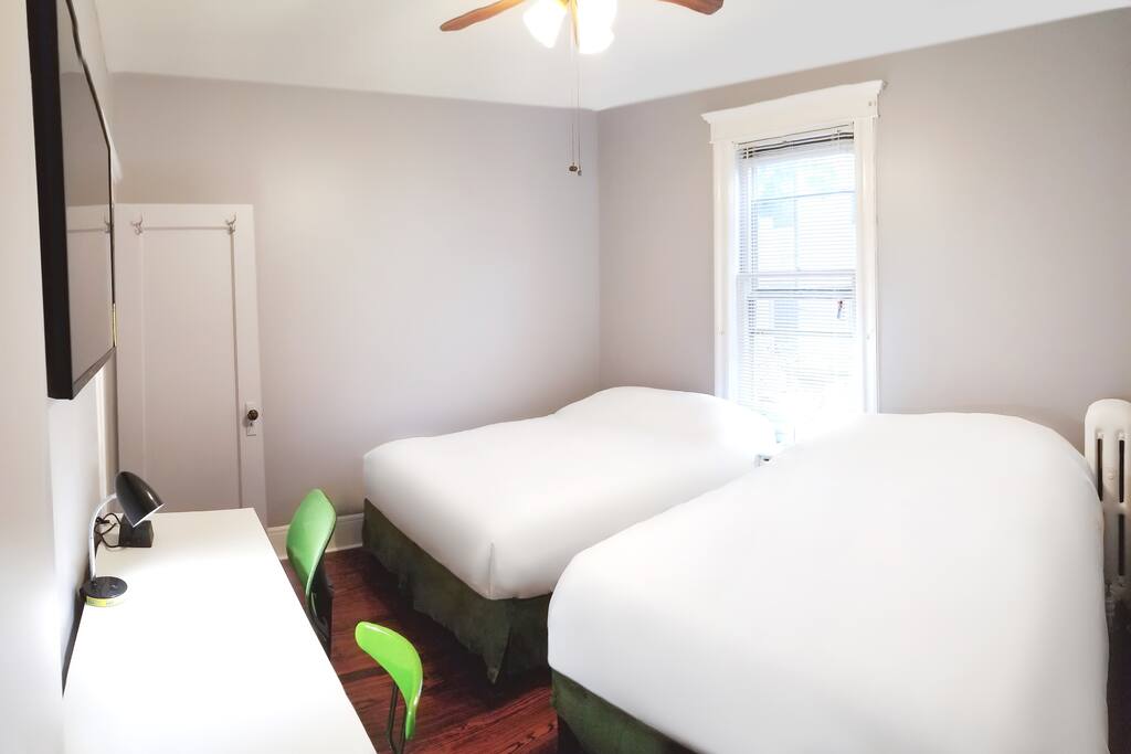 Bedroom with 2 double beds featuring some of the most comfortable gel memory foam mattresses in the industry for a good night's sleep