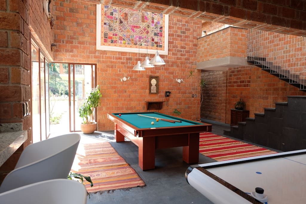 Living room with pool and air-hockey tables