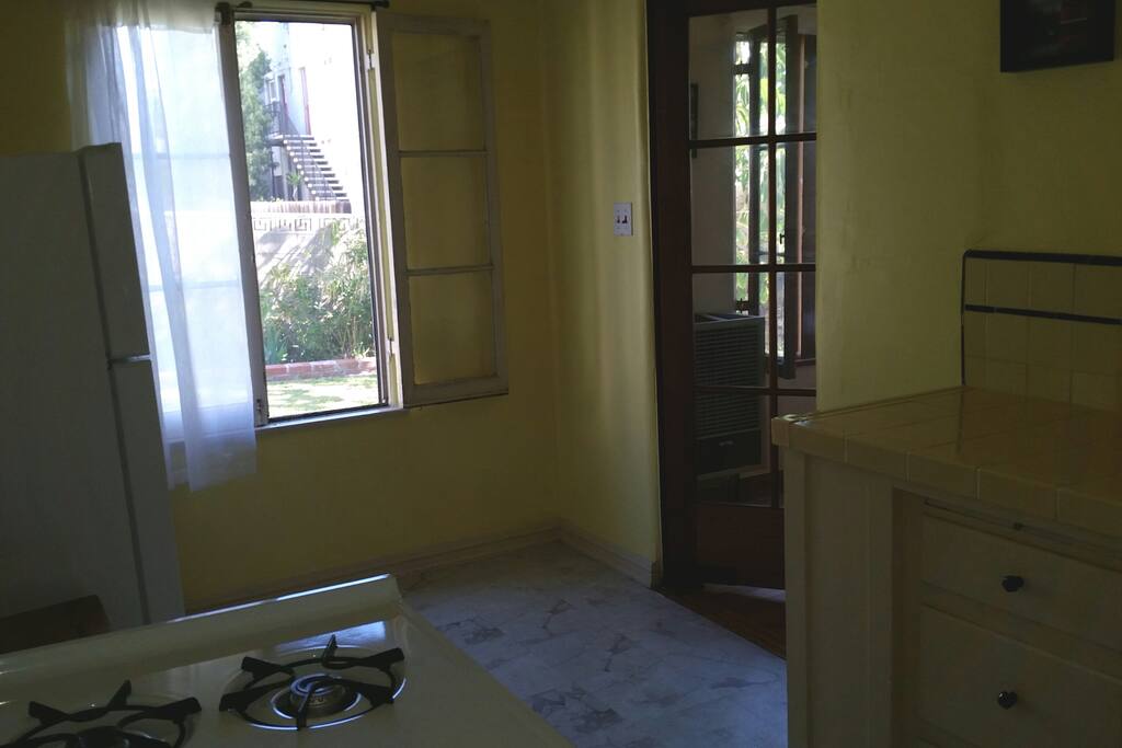 Kitchen with full size fridge and gas stove/oven
