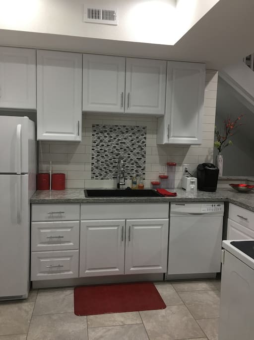 Full, private kitchen with full size oven, fridge, dishwasher, and microwave.