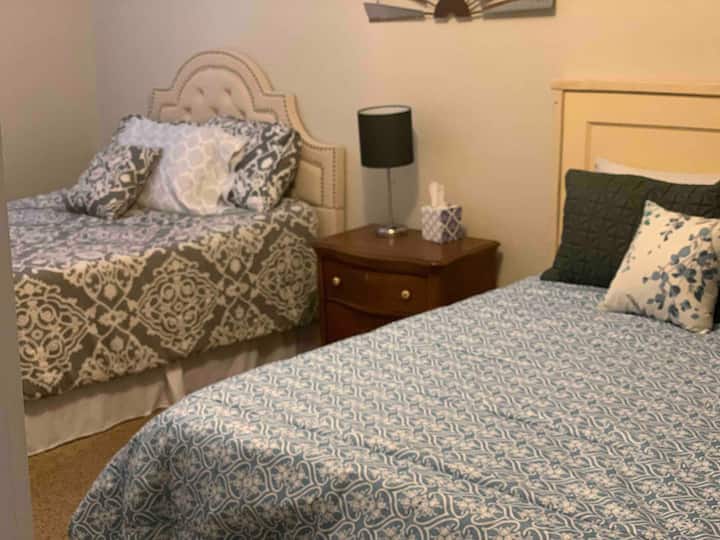 Very roomy and comfortable bedroom with a queen and a full size bed. Perfect for families or friends to stay together! 