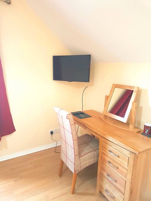 Solid oak dressing table has drawers for storage. A movable matching mirror.